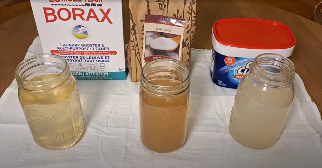 Jars of water after treating cotton rags with Borax, washing soda and OxiClean