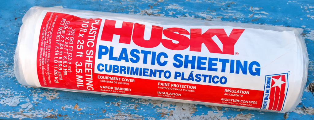 Roll of Husky clear plastic sheeting, 10 by 25 feet and 3.5 mil thick, used to cover our chicken runs in winter.
